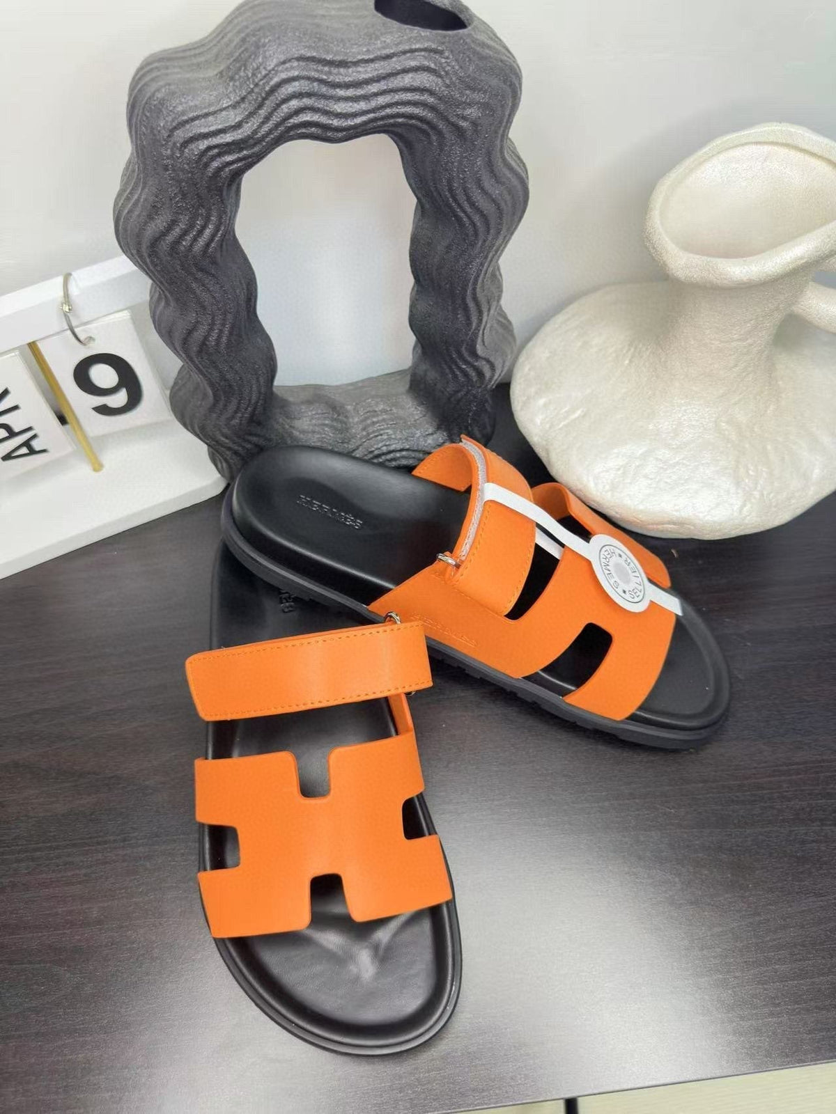 Hermès Orange Interwoven Slide Sandals - Orange and Black